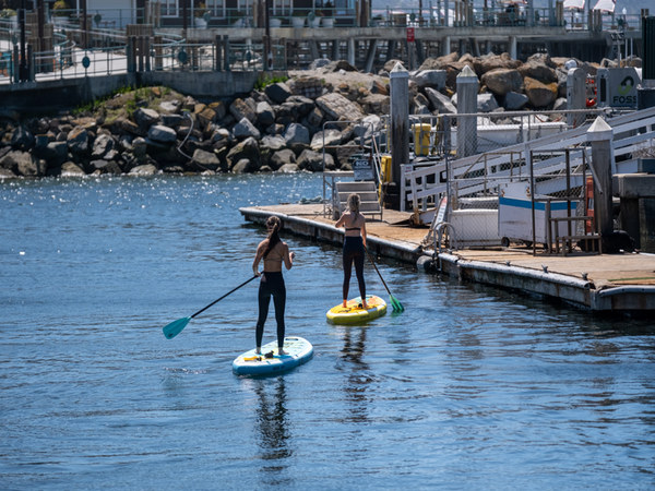 women on inflatable paddle boards