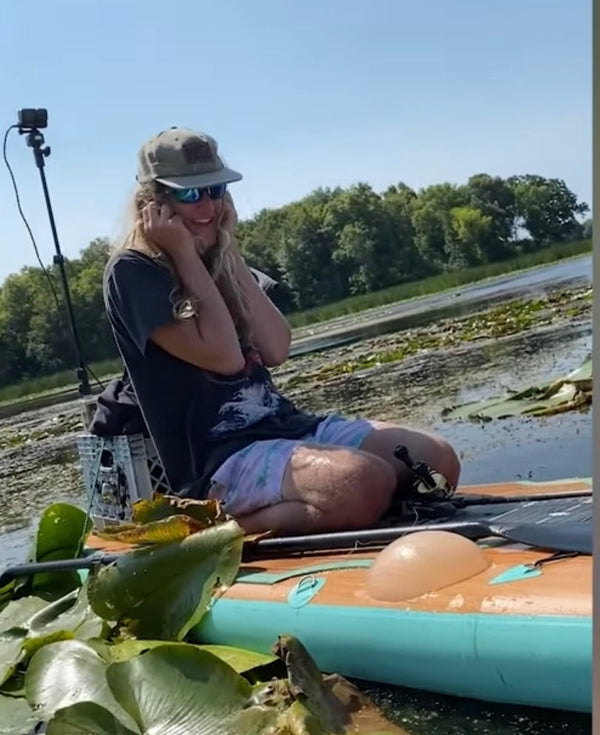 man on paddle board with bubble