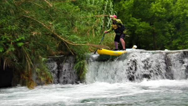 paddleboard on waterfall