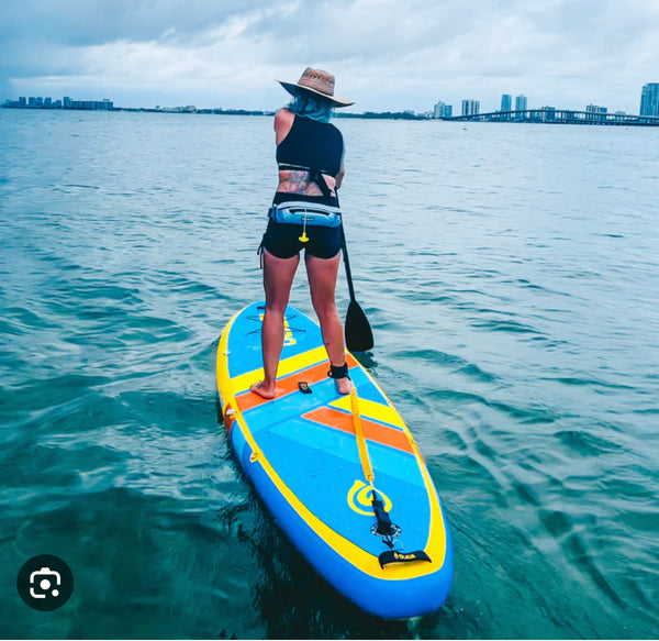 woman on inflatable paddle board