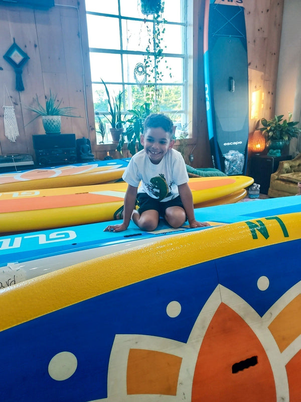 child on a paddle board