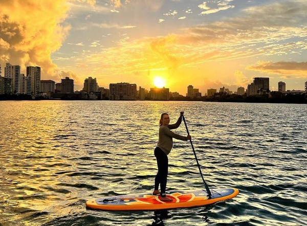 pregnant woman on paddle board