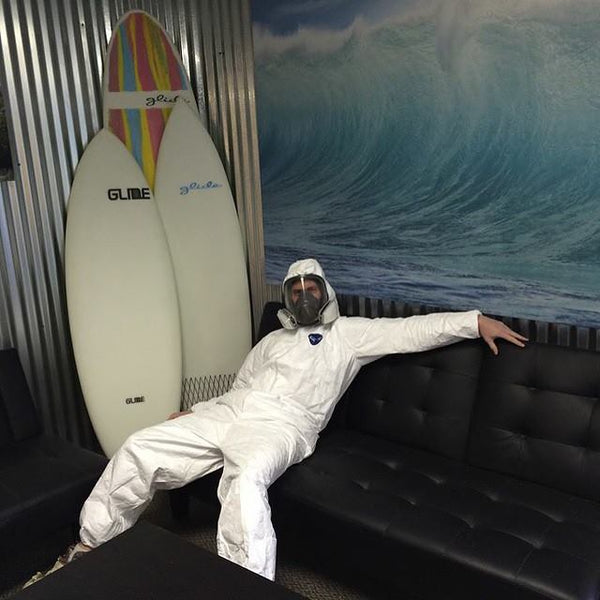 man next to paddle boards