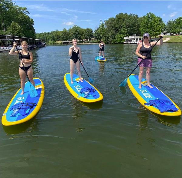 women on paddle boards