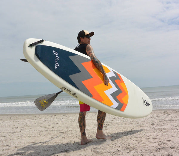 man holding sup board