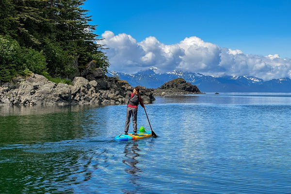paddle boarder in alaska