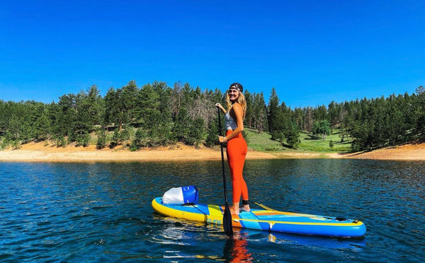 woman on an inflatable paddle board